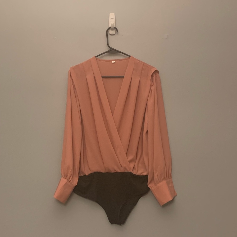 Woman’s blush pink blouse
